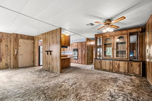 a view of a kitchen with furniture and a window