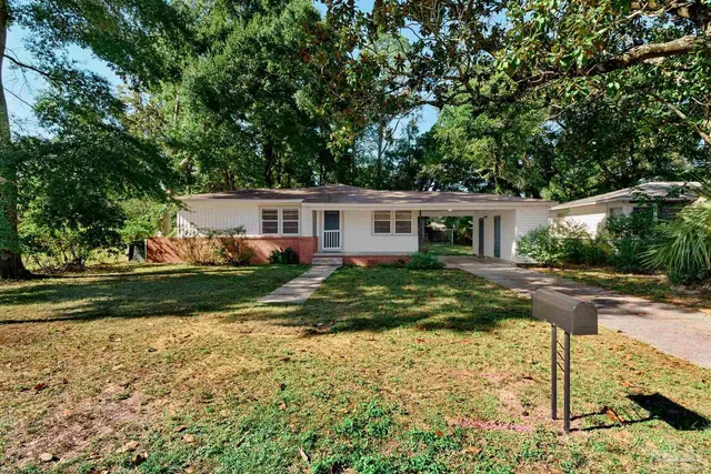 front view of a house with a yard