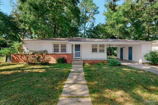 front view of a house with a yard