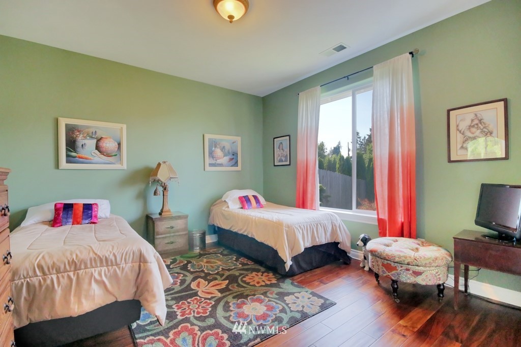 9908 Meadow Road Southwest Lakewood, WA 98499 - Photo 11 of 25 a bedroom with bed and a window