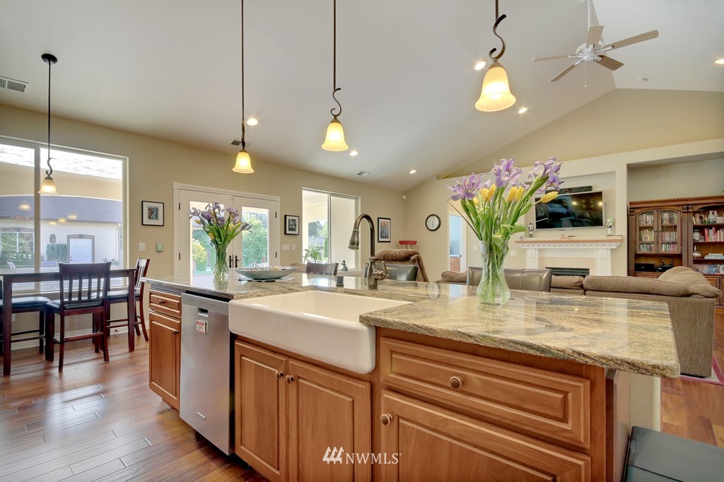 9908 Meadow Road Southwest Lakewood, WA 98499 - Photo 13 of 25 a kitchen with sink stove and dining table