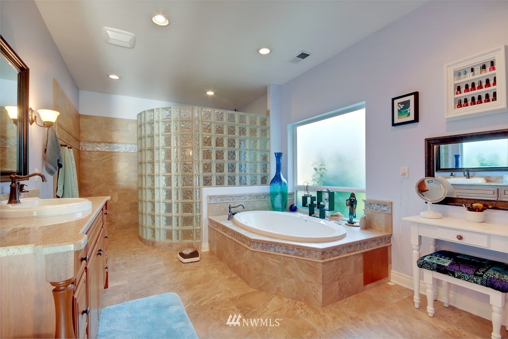 9908 Meadow Road Southwest Lakewood, WA 98499 - Photo 16 of 25 a living room with furniture a flat screen tv and a large window