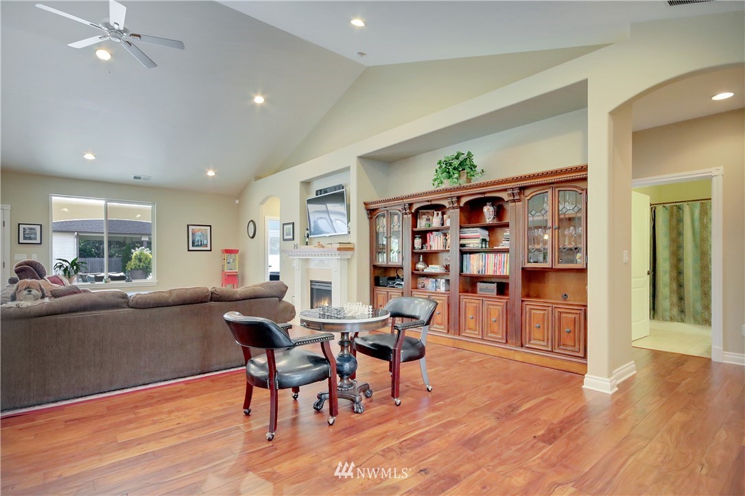 9908 Meadow Road Southwest Lakewood, WA 98499 - Photo 5 of 25 a dining room with furniture and wooden floor