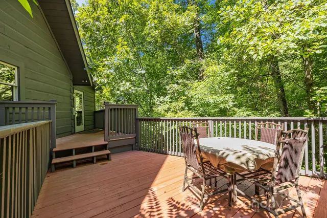 a view of balcony with furniture and wooden deck