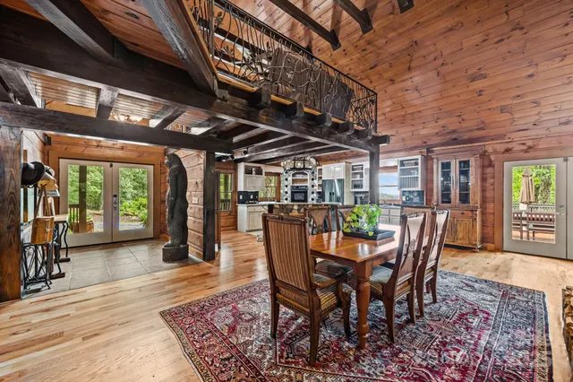 a dining room with furniture wooden floor and a rug