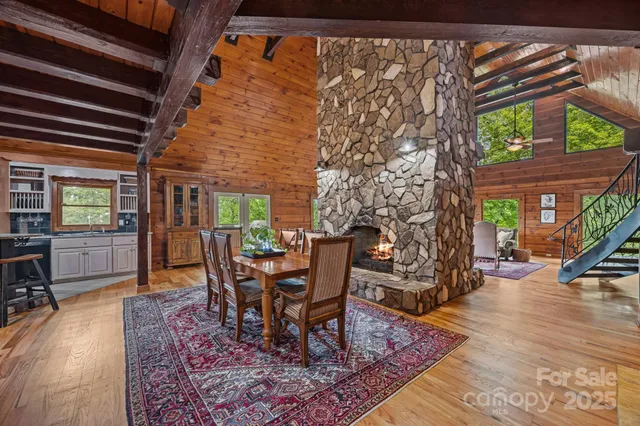 a dining room with furniture and wooden floor