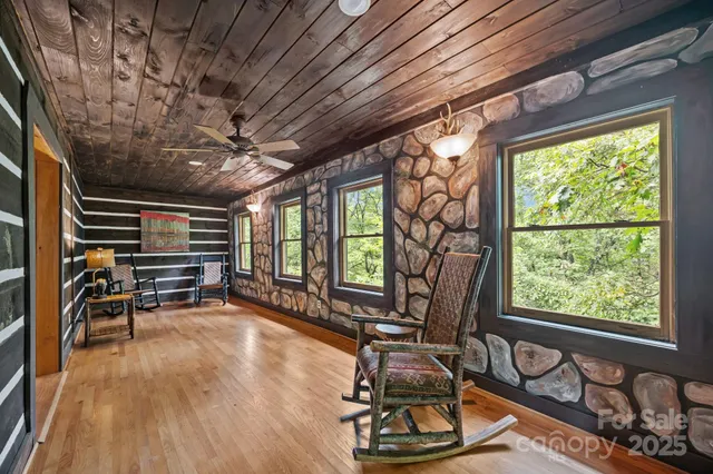 a room with wooden floors and furniture