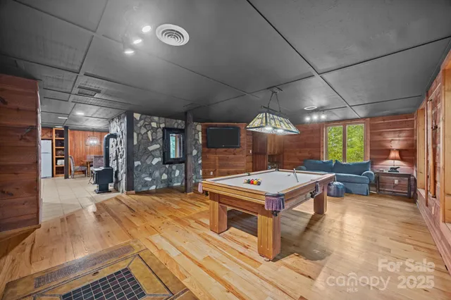 a room with lots of furniture and a large window