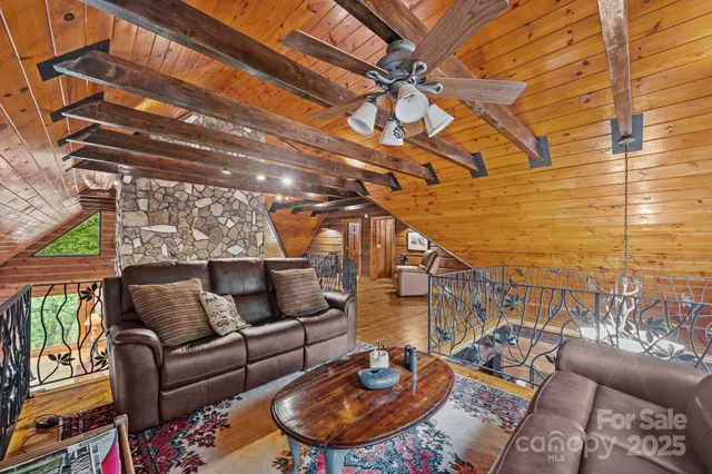 a roof deck with couch and chairs