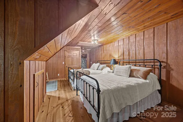 a bed room with a bed and a chandelier