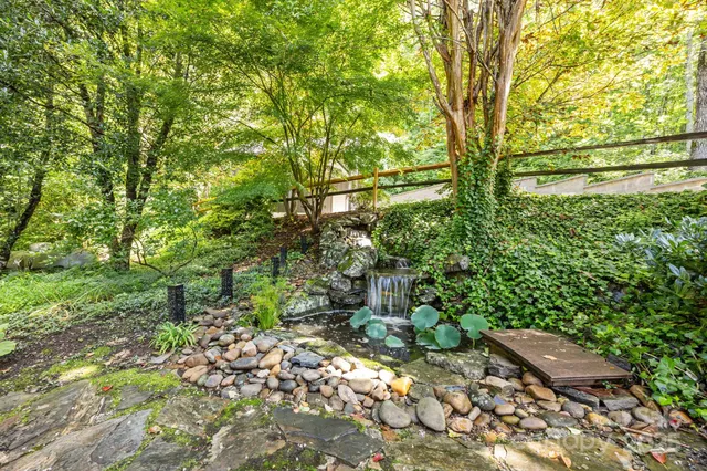 a backyard of a house with lots of green space