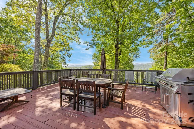 a view of a patio with a table and chairs