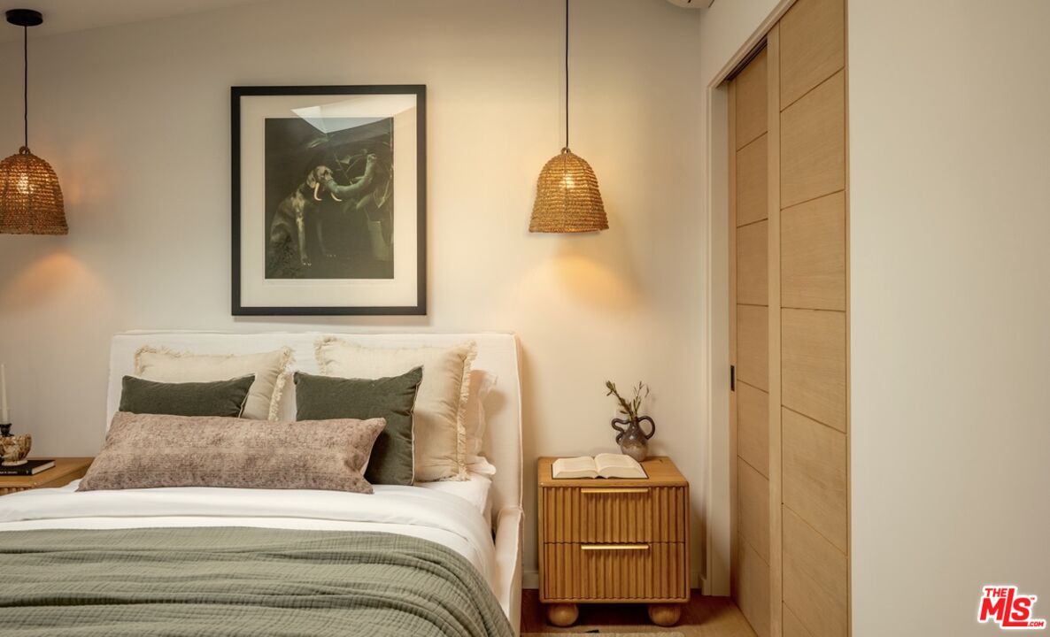 31376 Broad Beach Road Malibu, CA 90265 - Photo 15 of 32 a bedroom with a bed and a painting on the wall