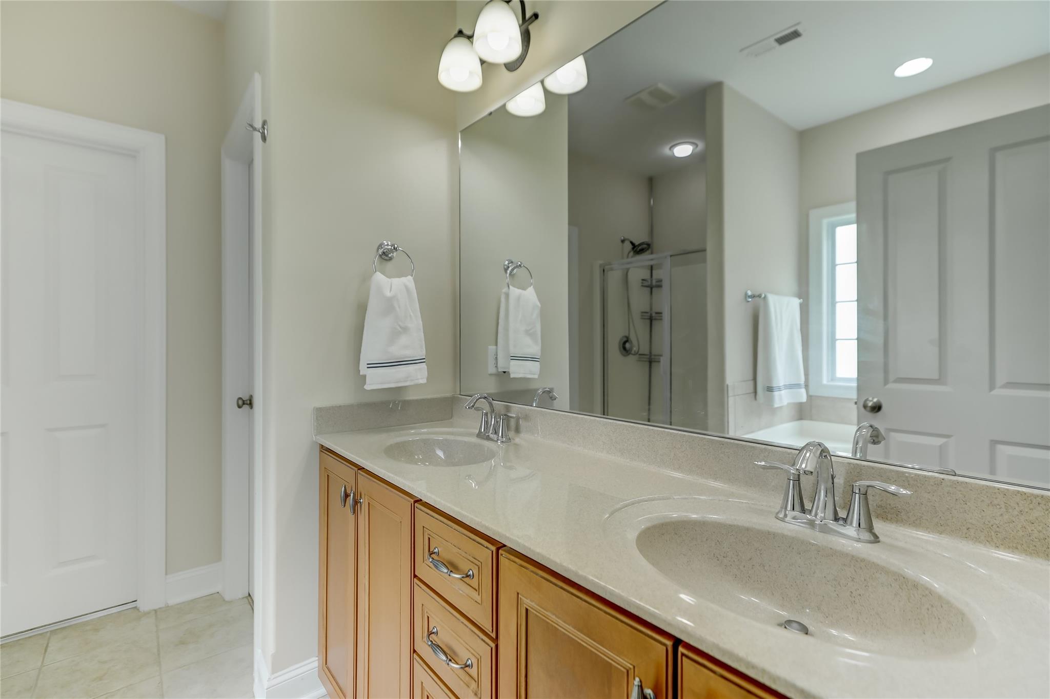 2005 Charles Avenue Lancaster, SC 29720 - Photo 19 of 42 a bathroom with a sink double vanity and a mirror