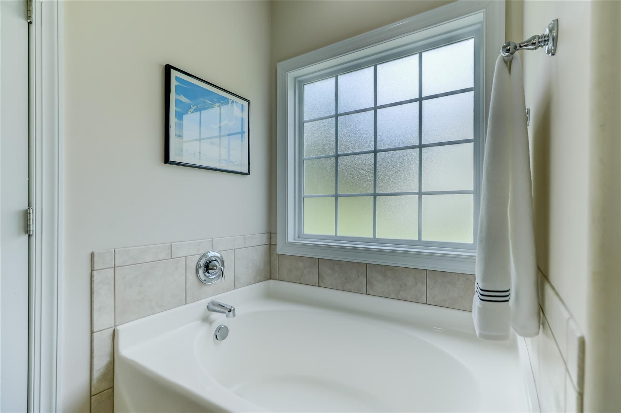 2005 Charles Avenue Lancaster, SC 29720 - Photo 21 of 42 a white bath tub sitting next to a window