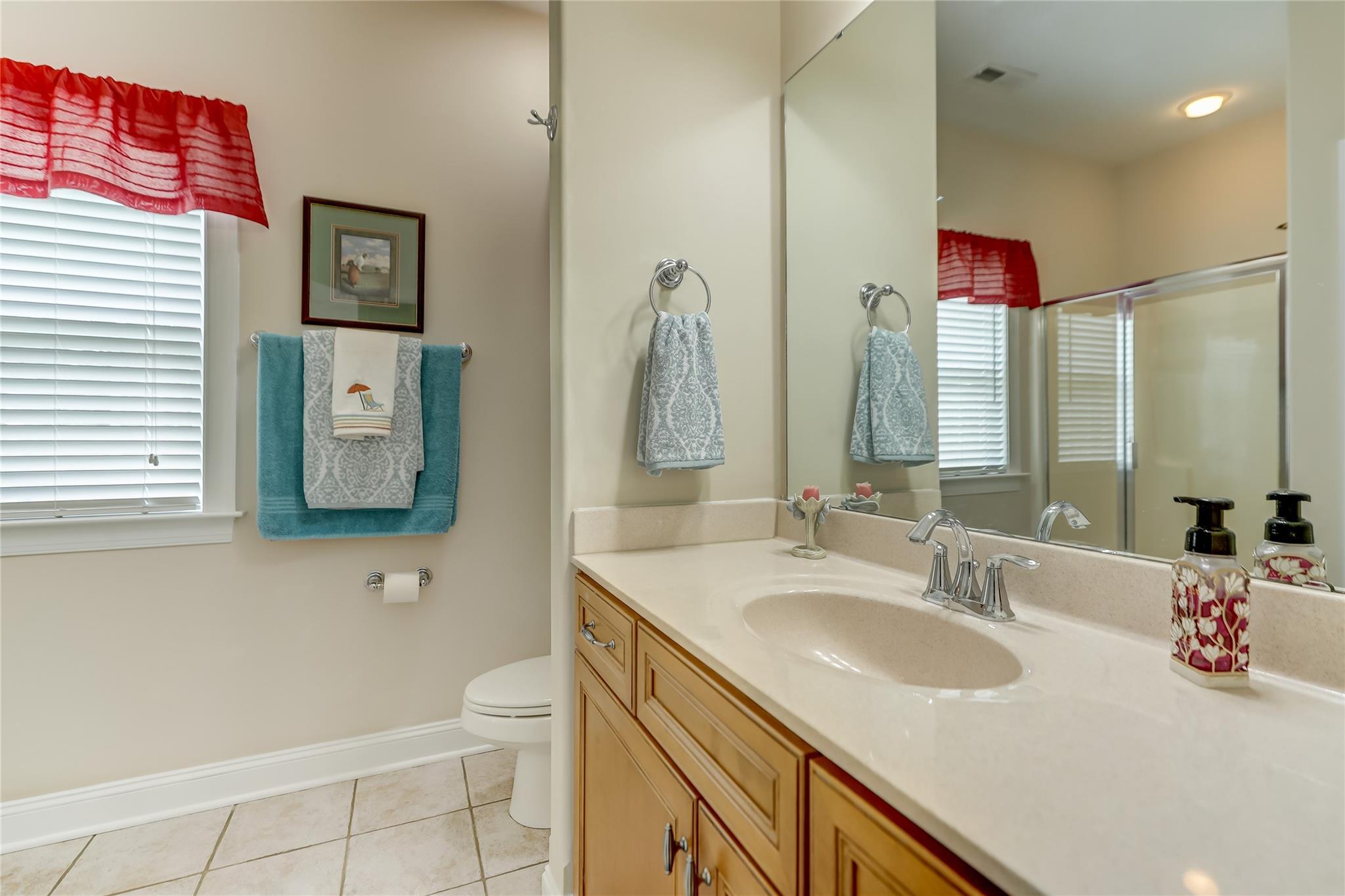2005 Charles Avenue Lancaster, SC 29720 - Photo 24 of 42 a bathroom with a granite countertop sink and a mirror
