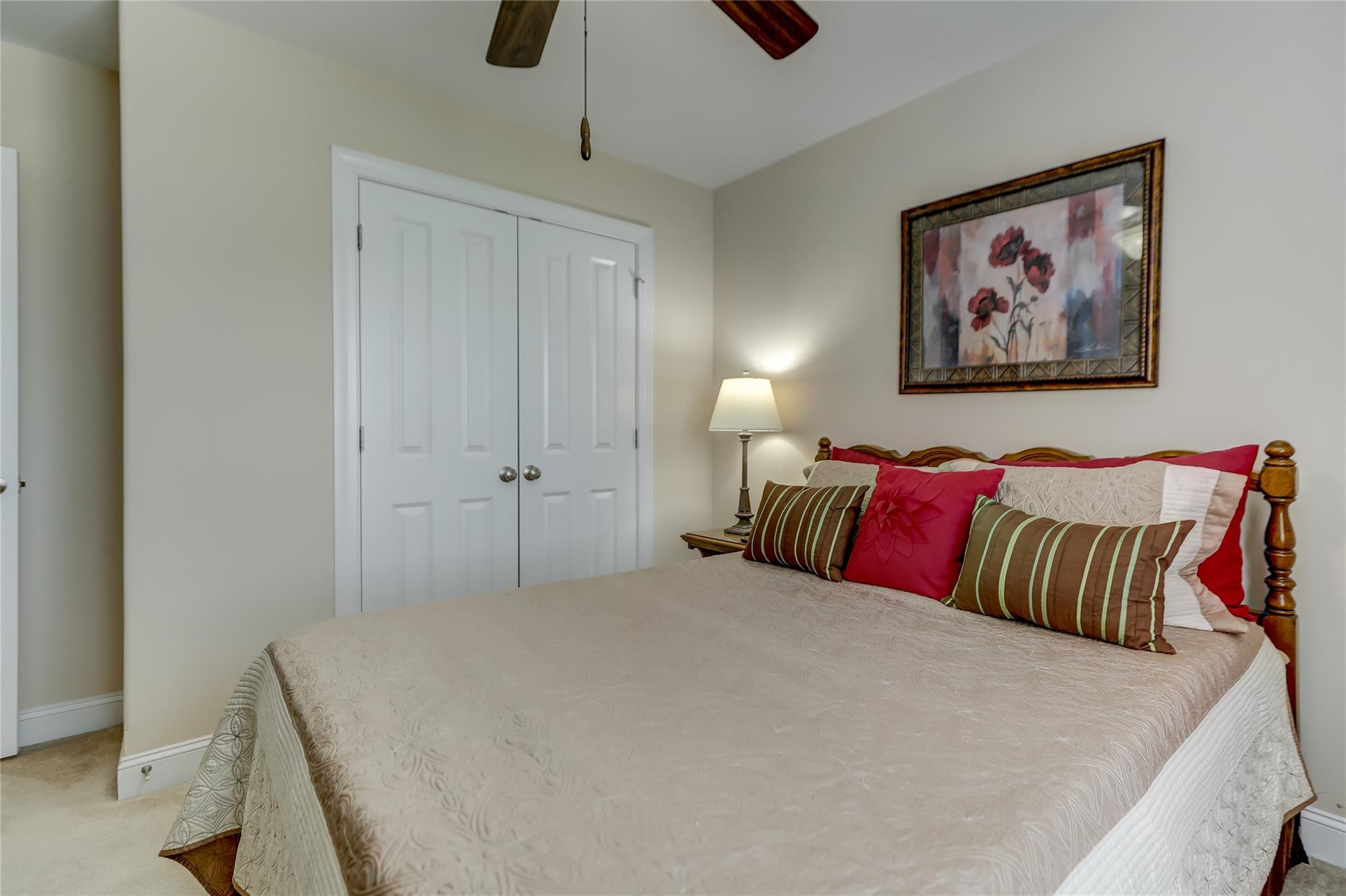 2005 Charles Avenue Lancaster, SC 29720 - Photo 32 of 42 a bedroom with a large bed and a chandelier