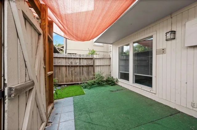 a backyard of a house with a garden