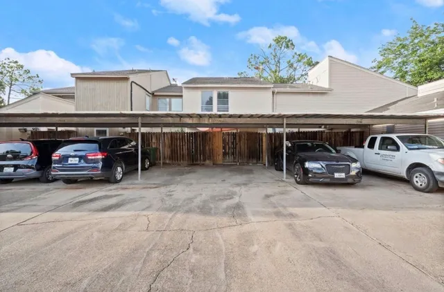 a view of a car parked in front of a building