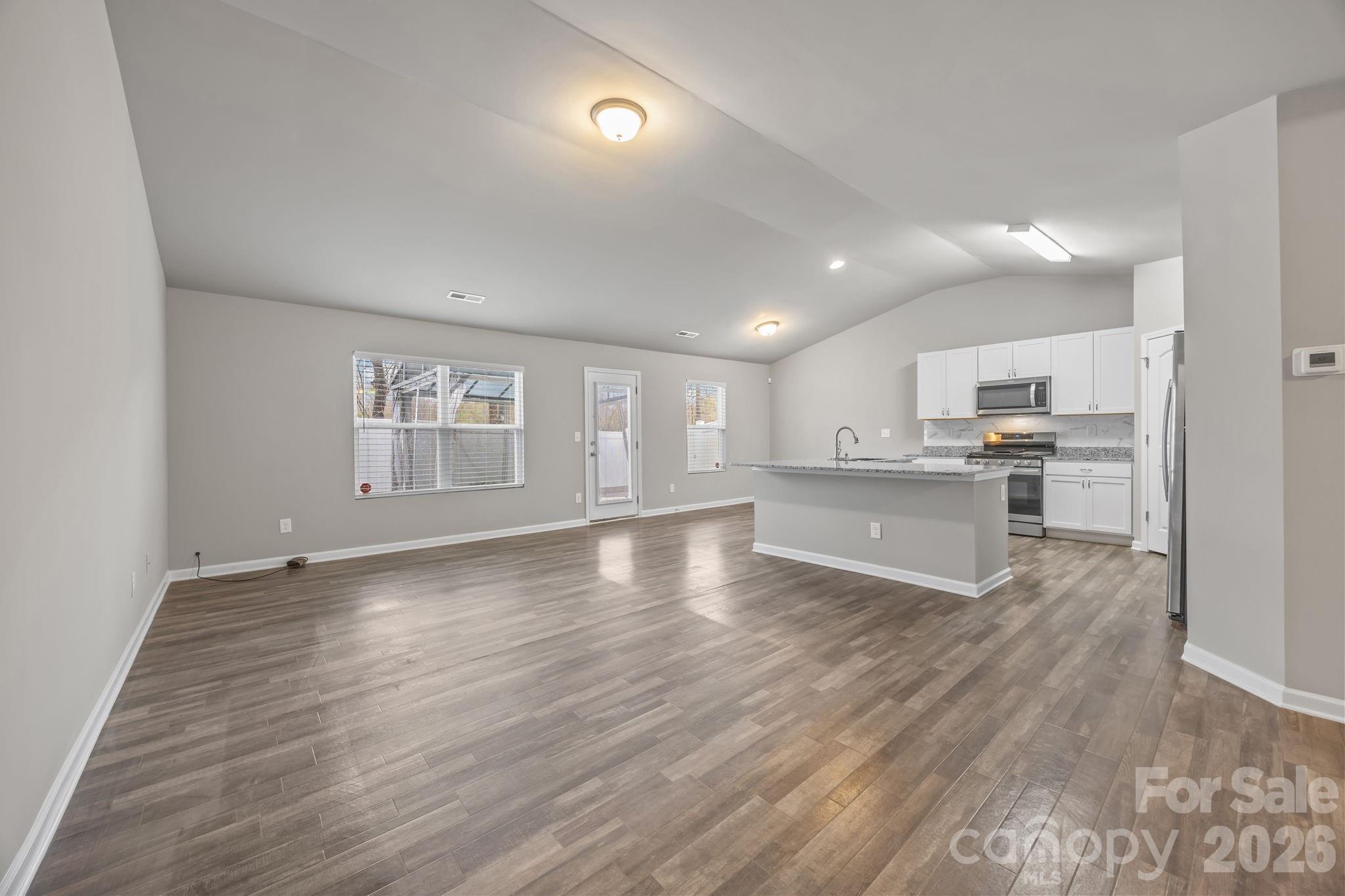 1219 Amberlight Circle Salisbury, NC 28144 - Photo 11 of 30 a view of kitchen with wooden floor and window