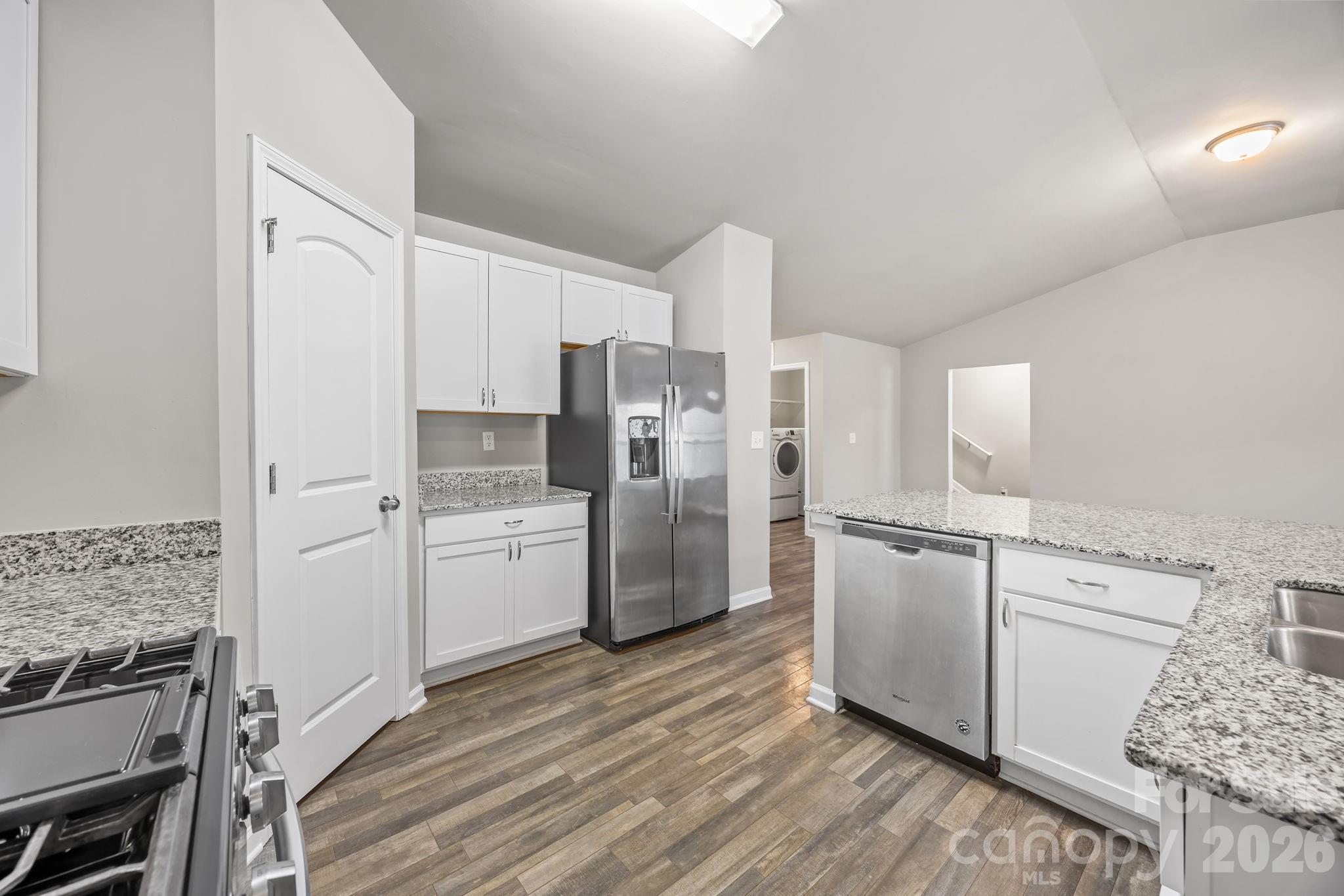 1219 Amberlight Circle Salisbury, NC 28144 - Photo 16 of 30 a kitchen with a refrigerator cabinets and wooden floor