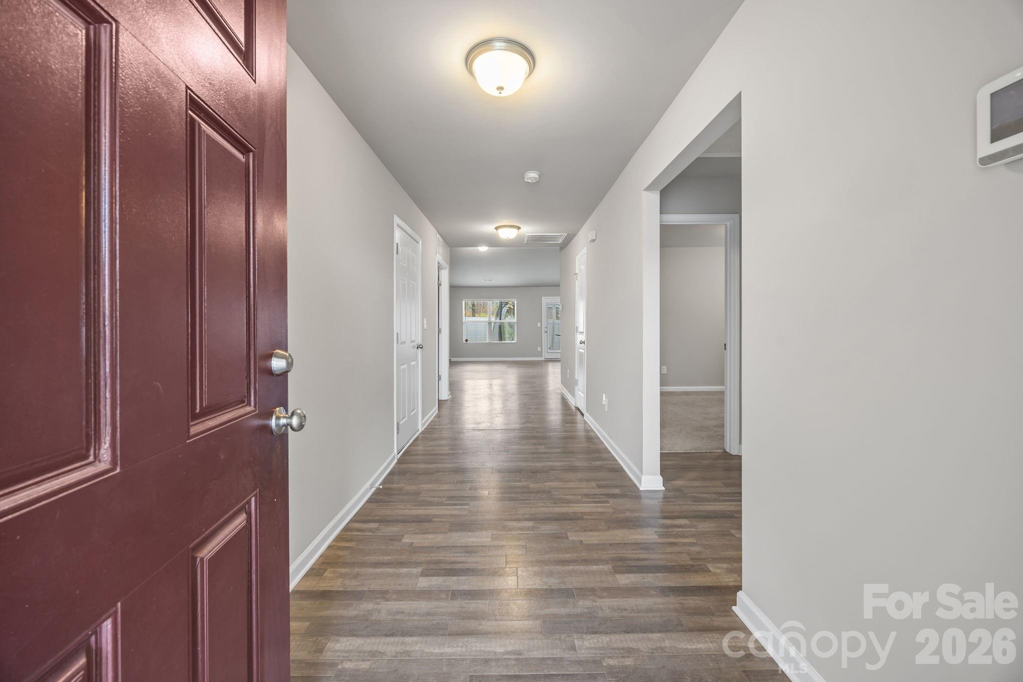 1219 Amberlight Circle Salisbury, NC 28144 - Photo 2 of 30 a view of a hallway with wooden floor