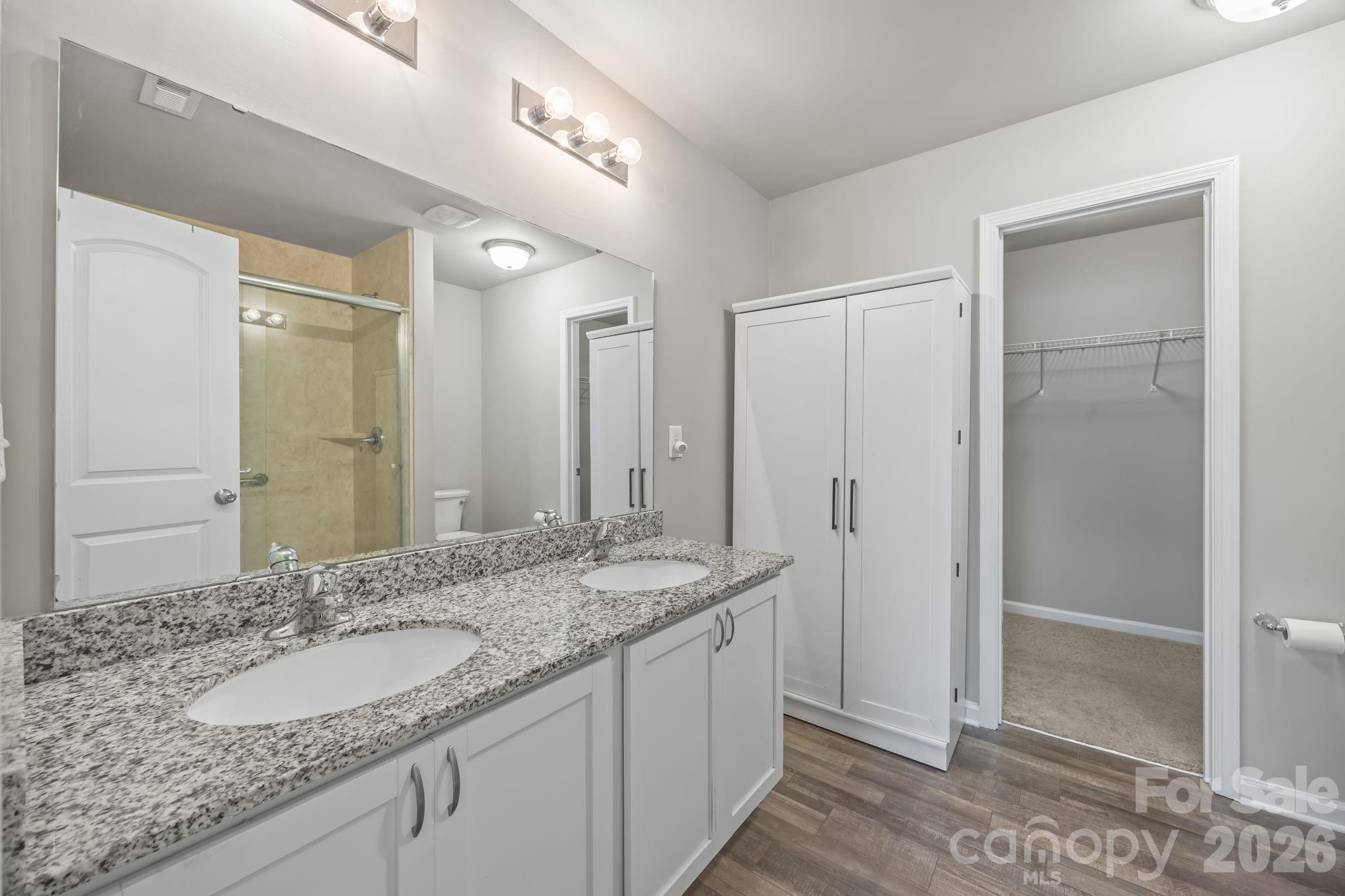 1219 Amberlight Circle Salisbury, NC 28144 - Photo 22 of 30 a bathroom with a granite countertop double vanity sink and mirror
