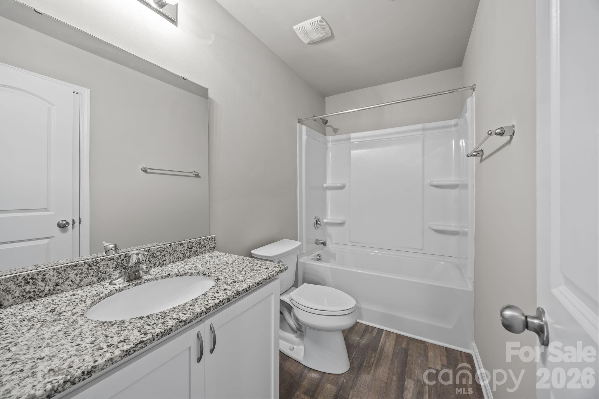 1219 Amberlight Circle Salisbury, NC 28144 - Photo 8 of 30 a bathroom with a granite countertop sink toilet and shower