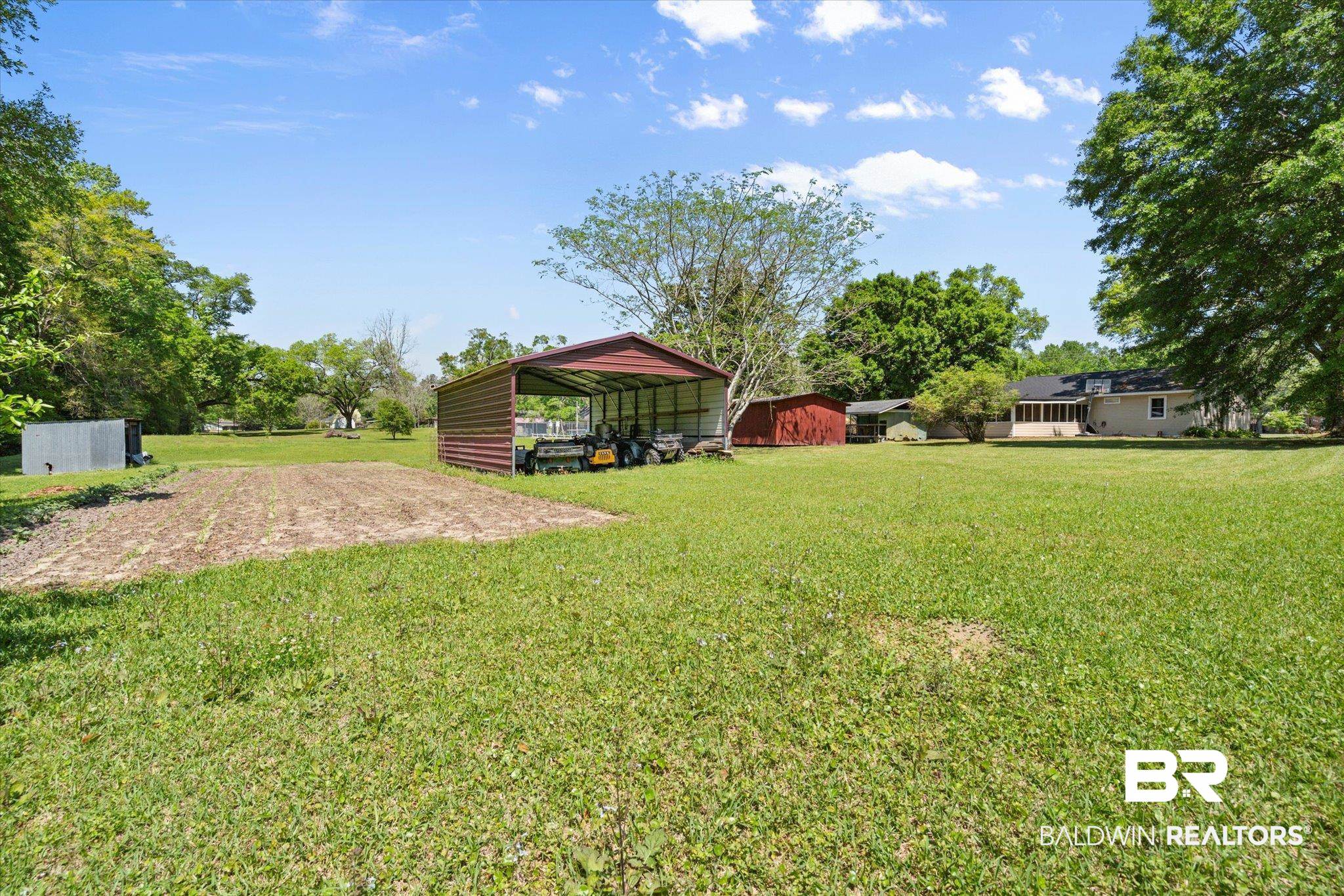 529 Cleveland Road Saraland, AL 36571 - Photo 27 of 31 View of yard featuring an outdoor structure and a detached carport
