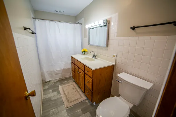 a bathroom with a sink a bathtub and a shower