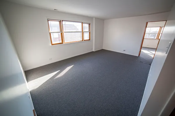 an empty room with windows