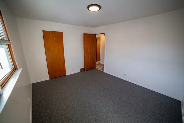 a view of an empty room and window