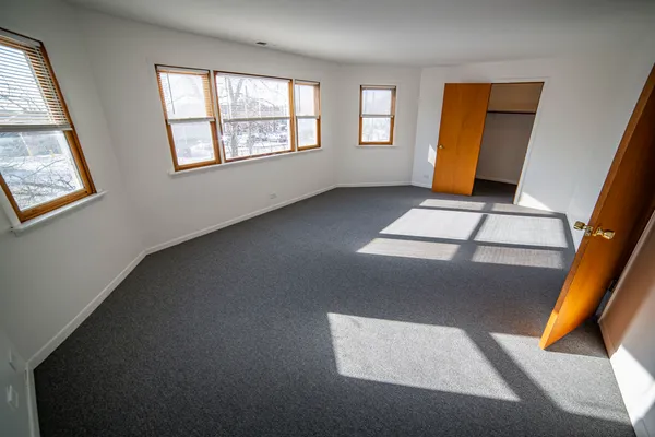 a bathroom with a sink a toilet a mirror and shower curtain