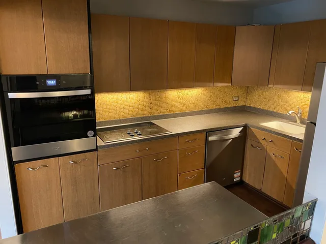 a kitchen with a sink and cabinets