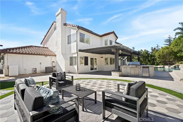 a view of a patio with couches table and chairs