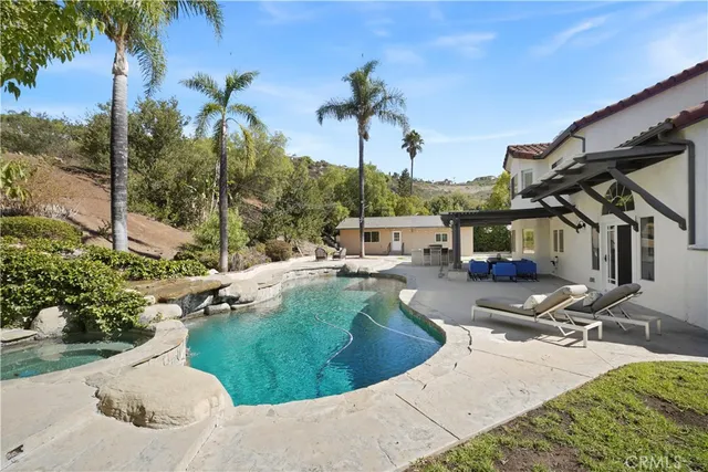 a view of a swimming pool with a patio