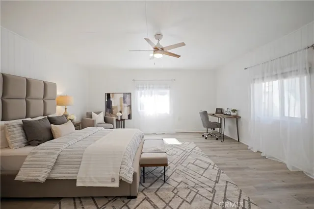 a bedroom with a bed and a table