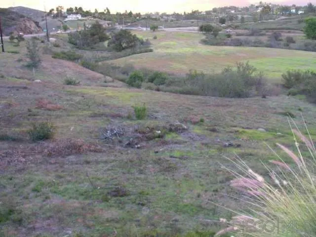 a view of outdoor space and green field