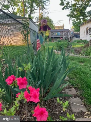 a view of a house with wooden fence
