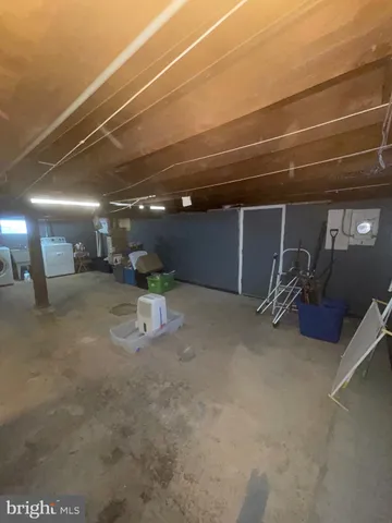 a view of a room with wooden walls