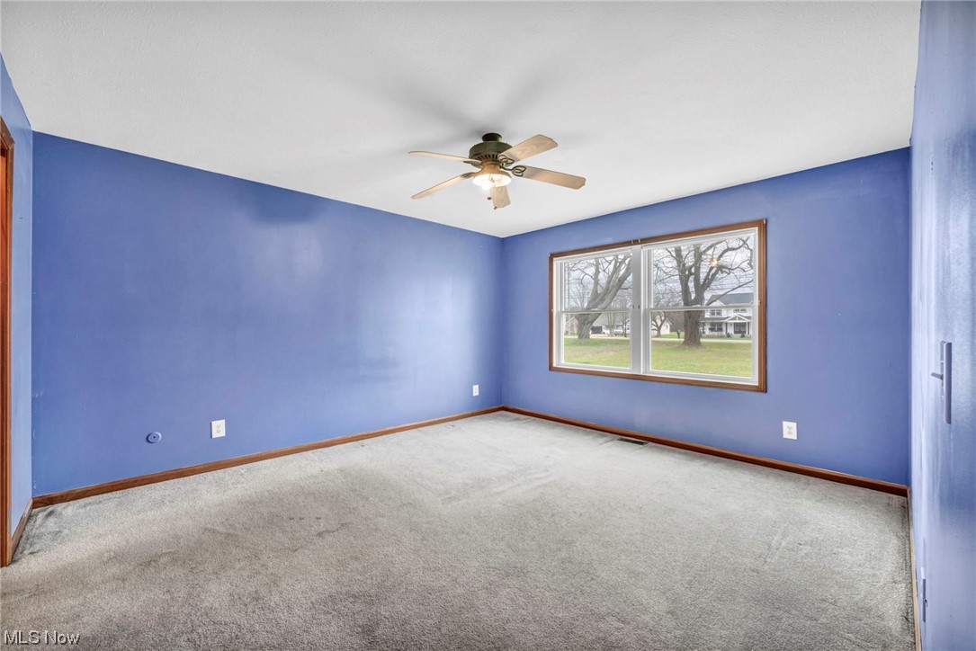 35808 Lorain Road North Ridgeville, OH 44039 - Photo 19 of 35 Unfurnished room with light colored carpet and ceiling fan