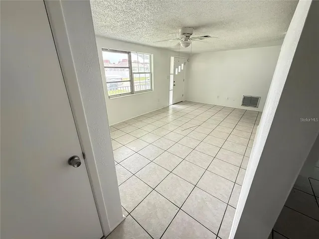 an empty room & glass door in a room