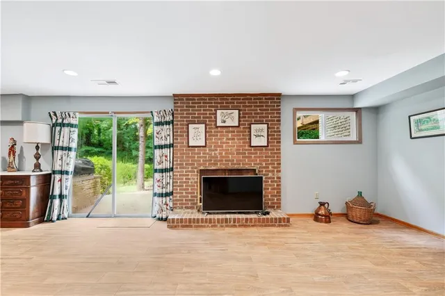 a large bedroom with a bed and a fireplace