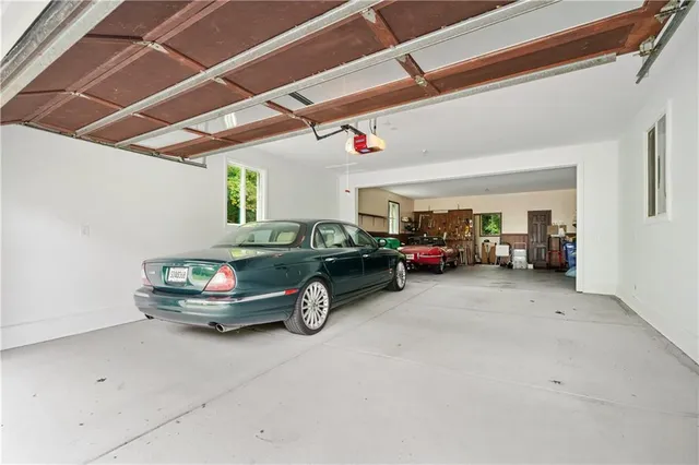 a view of a swimming pool with a patio and a yard