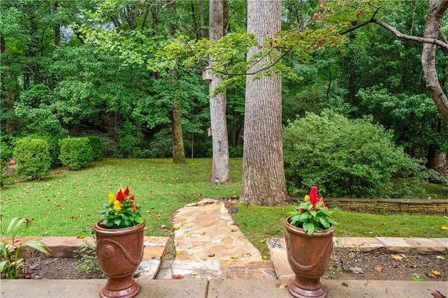 a view of a backyard with sitting area