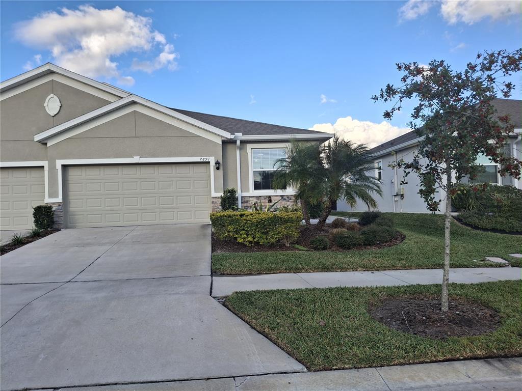 front view of a house with a yard