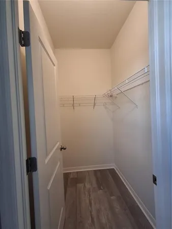 an empty room with large windows