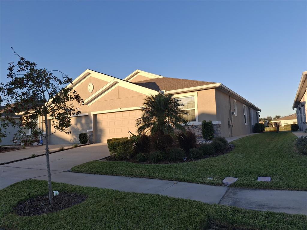 7891 Stonebrook Circle Wesley Chapel, FL 33545 - Photo 2 of 39 a view of a house with a yard