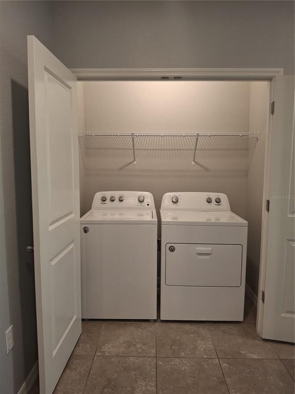 7891 Stonebrook Circle Wesley Chapel, FL 33545 - Photo 21 of 39 a utility room with dryer and washer