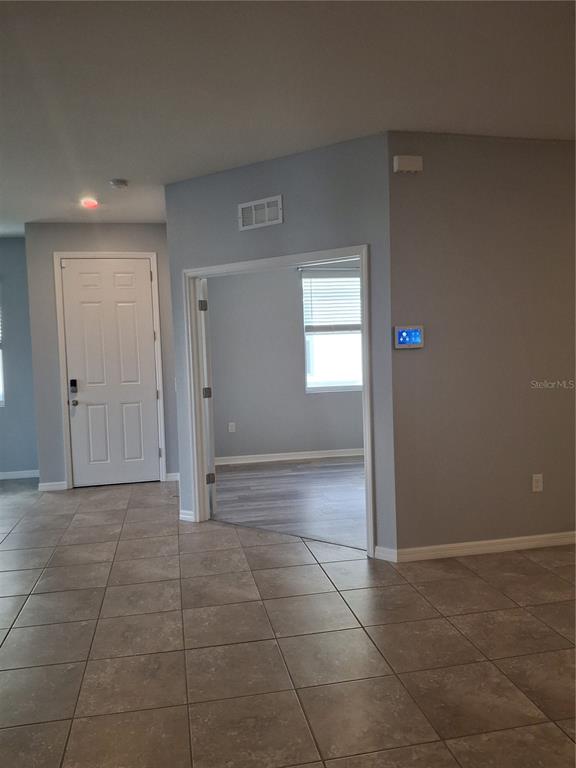 7891 Stonebrook Circle Wesley Chapel, FL 33545 - Photo 23 of 39 a view of an empty room and window